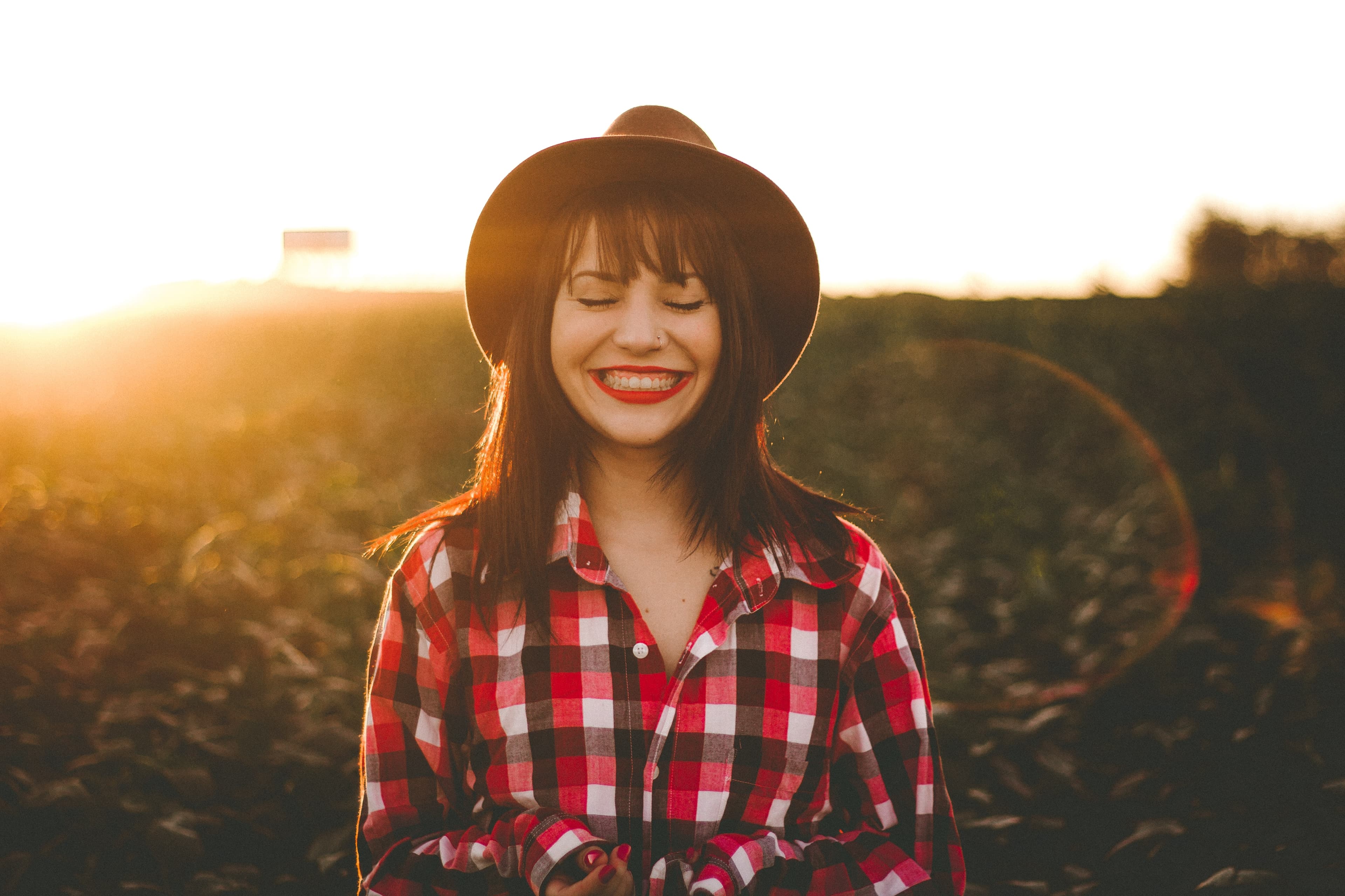 Woman with red lipstick smiling